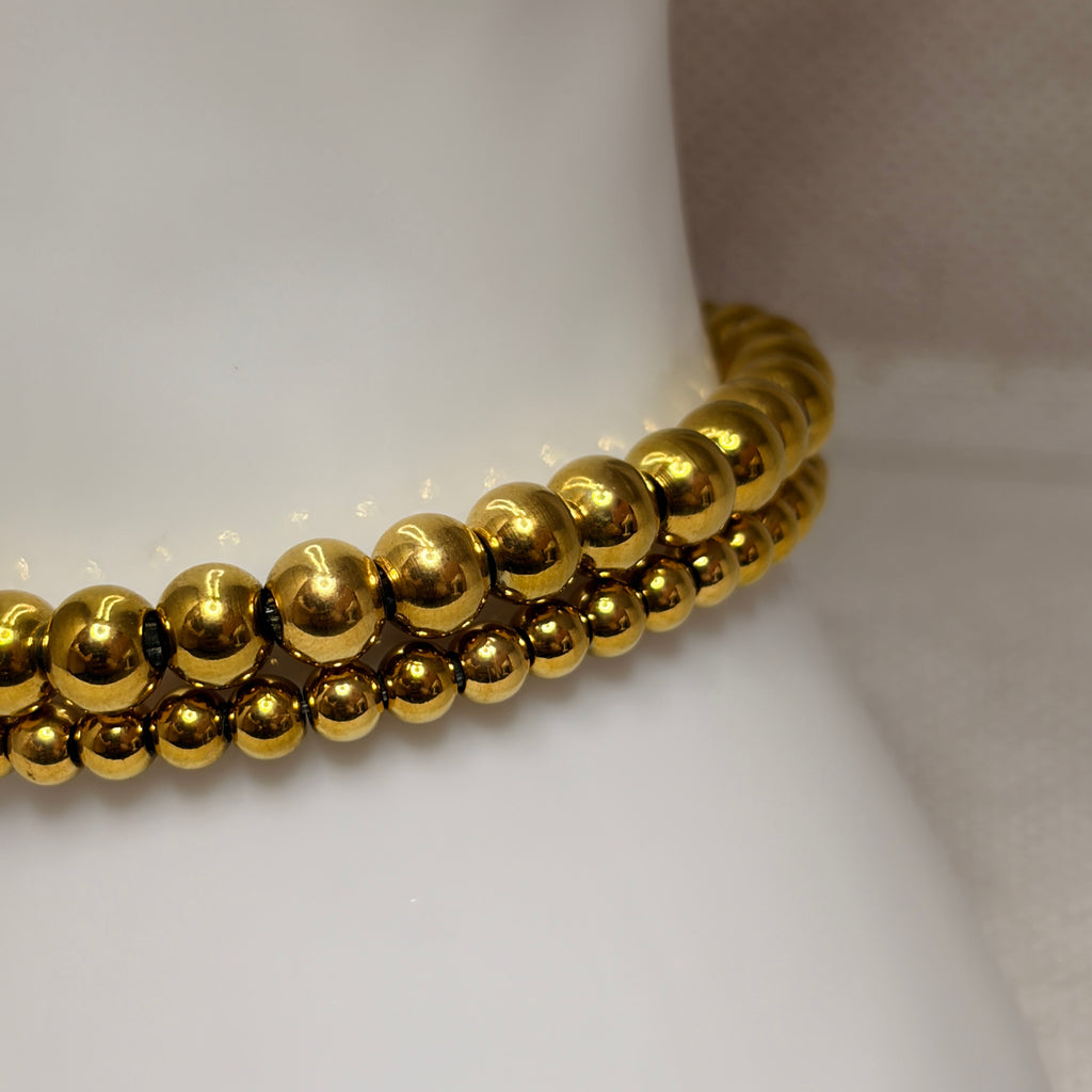 Pulsera elástica bolitas dorada