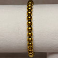 Pulsera elástica bolitas dorada