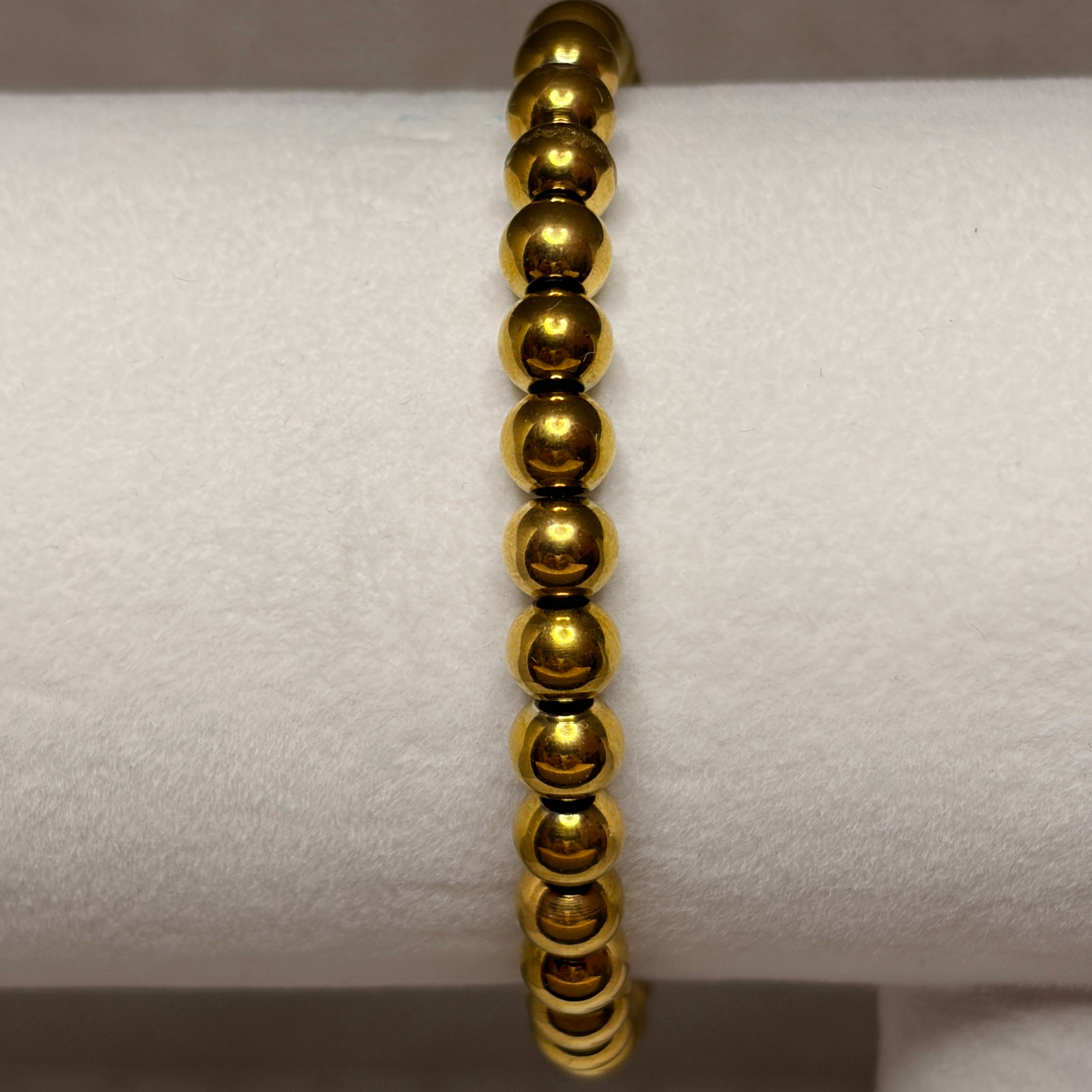 Pulsera elástica bolitas dorada
