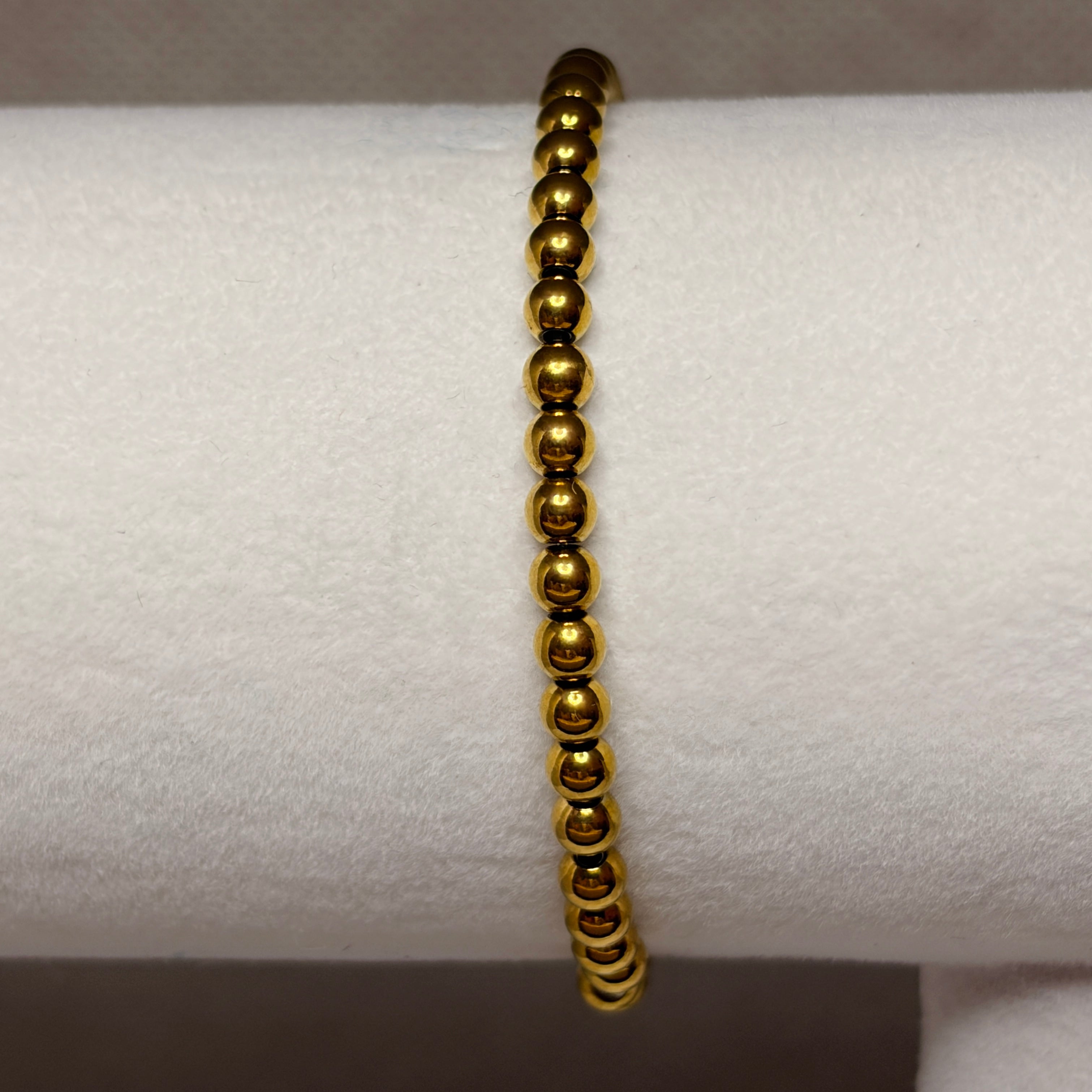 Pulsera elástica bolitas dorada