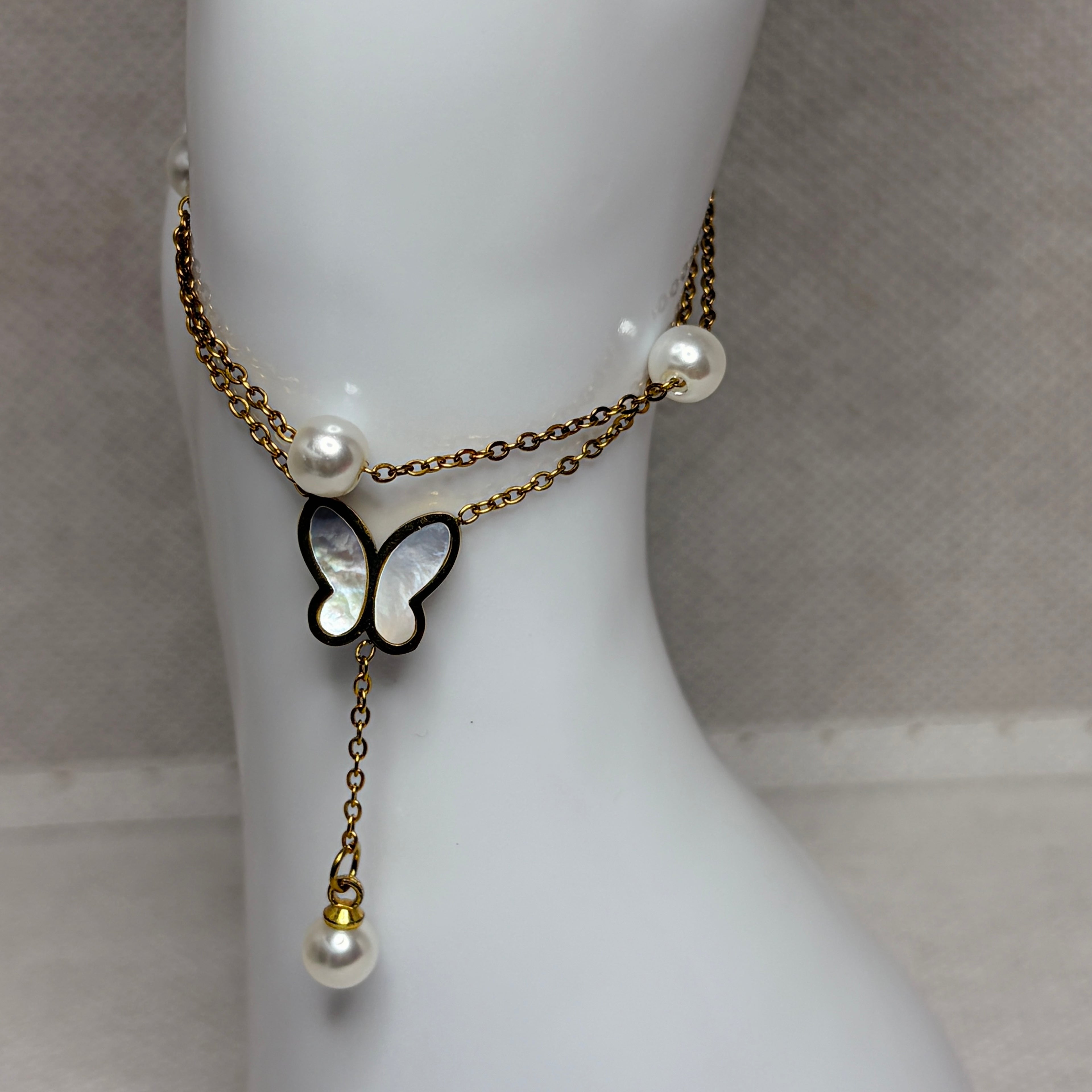 Pulsera mariposa con perlas